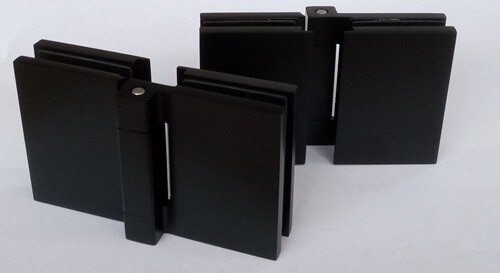 Black glass to glass hinges with concealed fixings